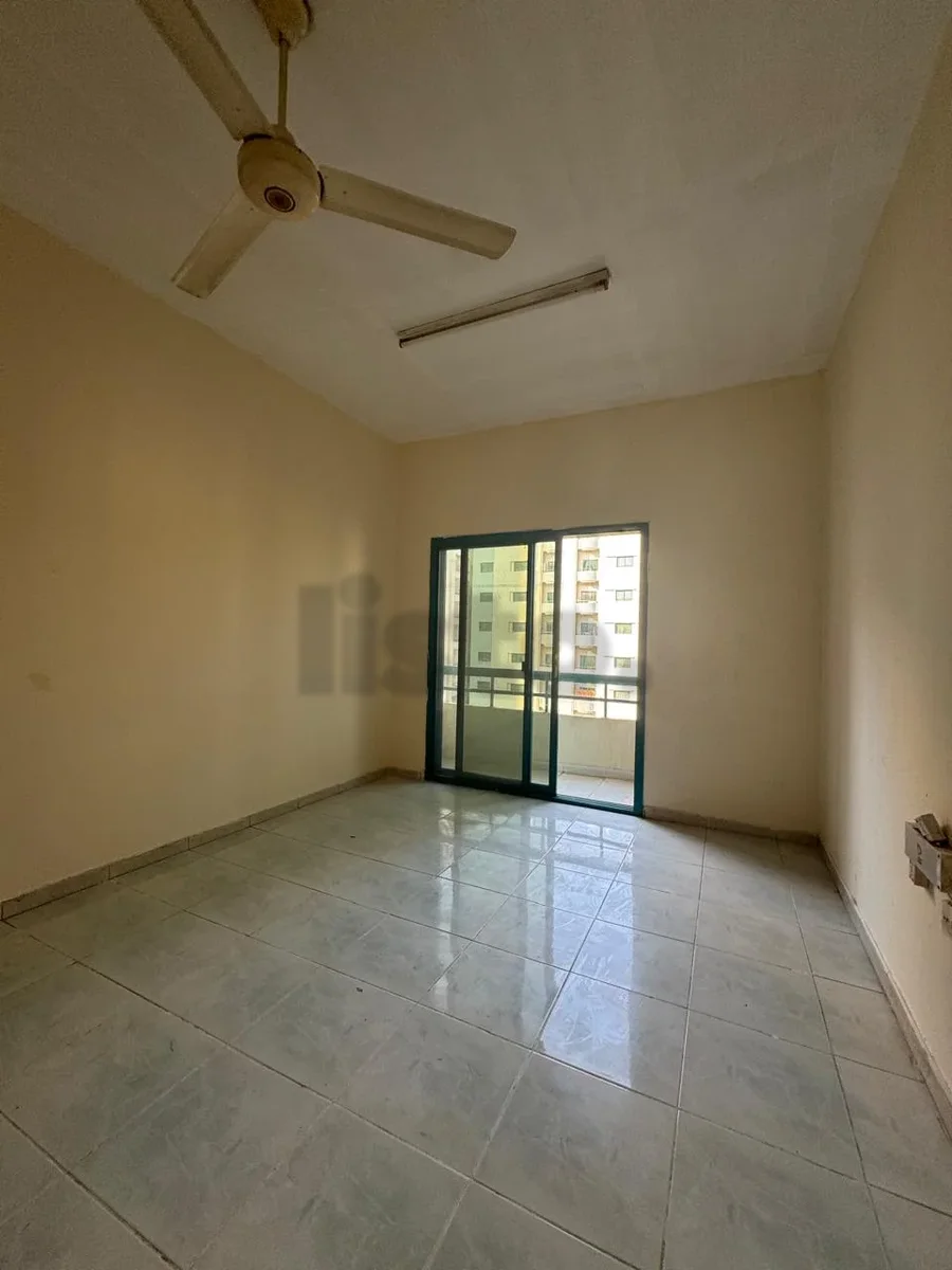 Two rooms and a hall, Al Qassimia, balcony, open view, free maintenance, central air conditioning.