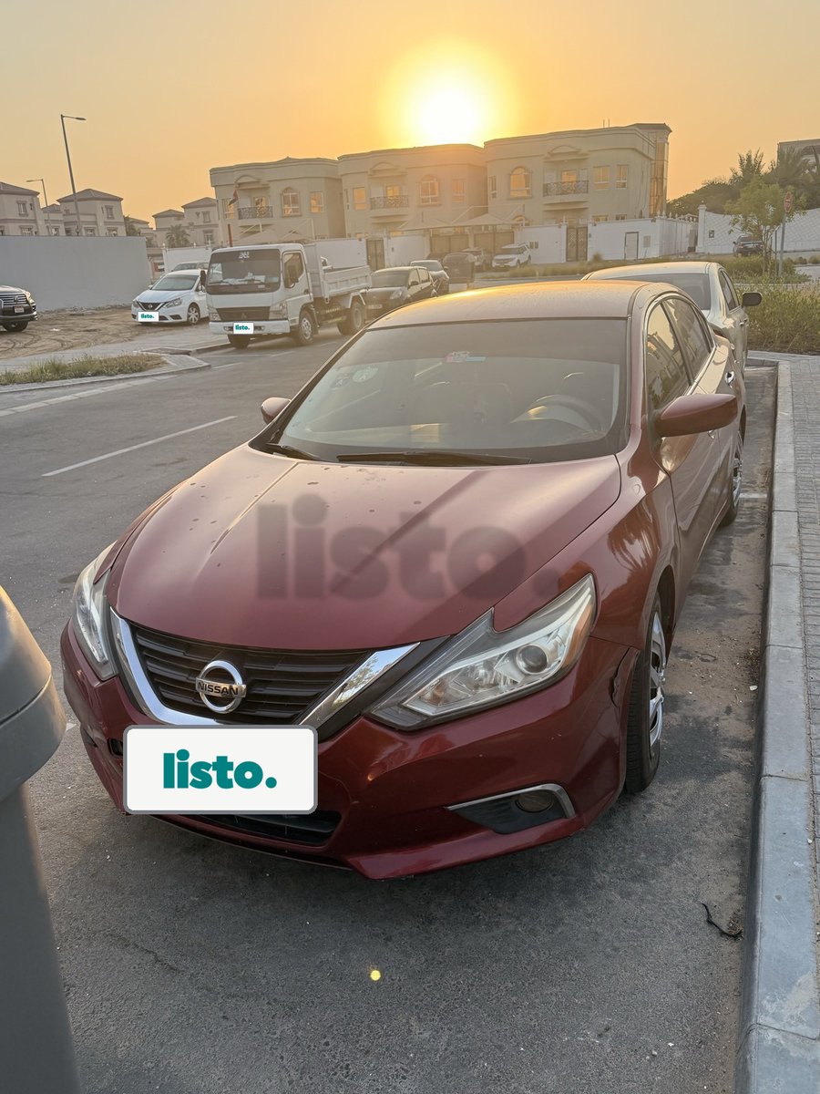 Red Nissan Sedan for Sale - Good Condition, Sharjah Plate